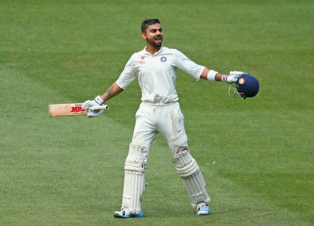 An exuberant Kohli celebrates reaching his century during day three of the Third Test match between Australia and India at Melbourne Cricket Ground on December 28, 2014 in Melbourne, Australia.  