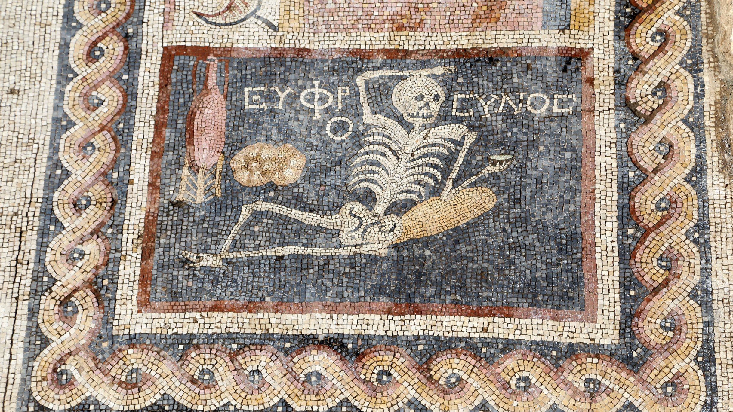 A skeleton on a 2,400-year-old mosaic found in Turkey advises "Be cheerful, enjoy your life."
