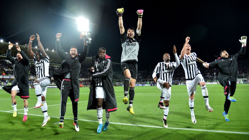 Juventus players celebrate their <a href="index.php?page=&url=http%3A%2F%2Fwww.cnn.com%2F2016%2F04%2F25%2Ffootball%2Fjuventus-serie-a-napoli-roma%2F" target="_blank">fifth straight Italian league title</a> after a 2-1 victory at Fiorentina on Sunday, April 24. 