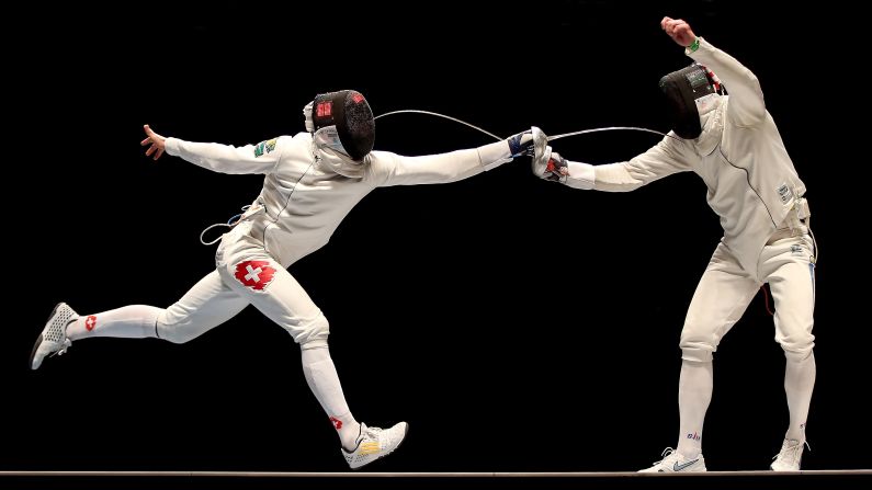 Swiss fencer Benjamin Steffen, left, competes against Ukraine's Bogdan Nikishin during a tournament in Rio de Janeiro on Sunday, April 24. Nikishin defeated Steffen to win the gold medal in the epee final.
