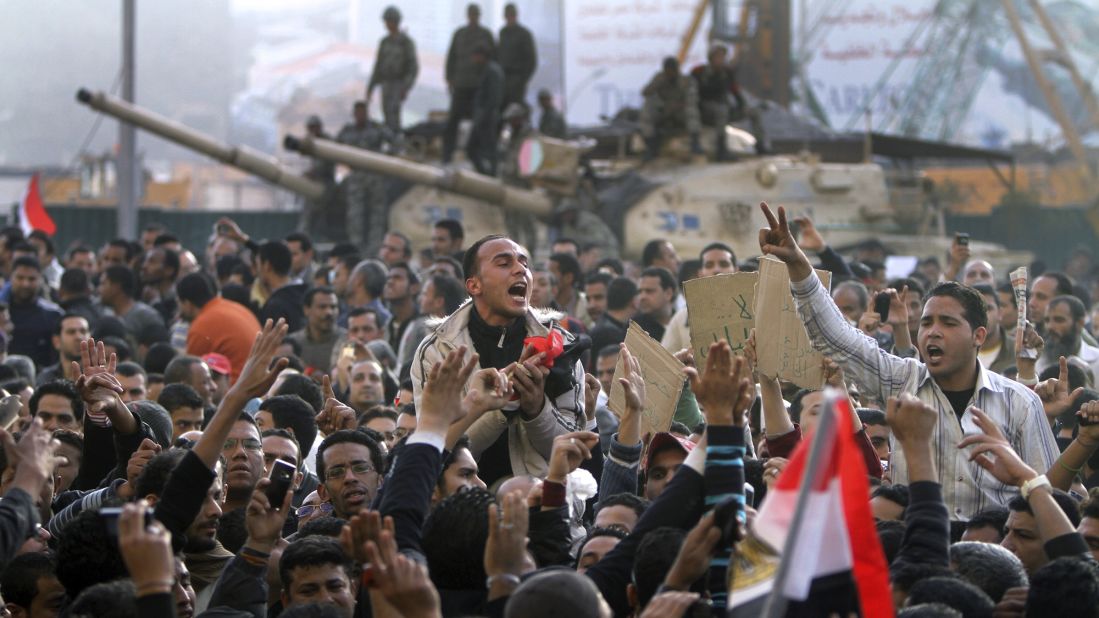 Egyptians protest in front of an army tank in Cairo in January 2011. Inspired by protests that ousted Tunisia's oppressive leader, tens of thousands of Egyptians demonstrated for an end to the 30-year rule of President Hosni Mubarak.