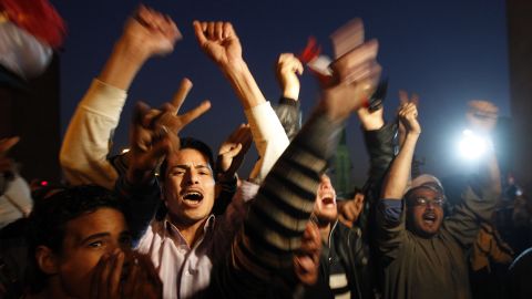 Egyptians celebrate in Cairo's Tahrir Square after Mubarak steps down in February 2011.