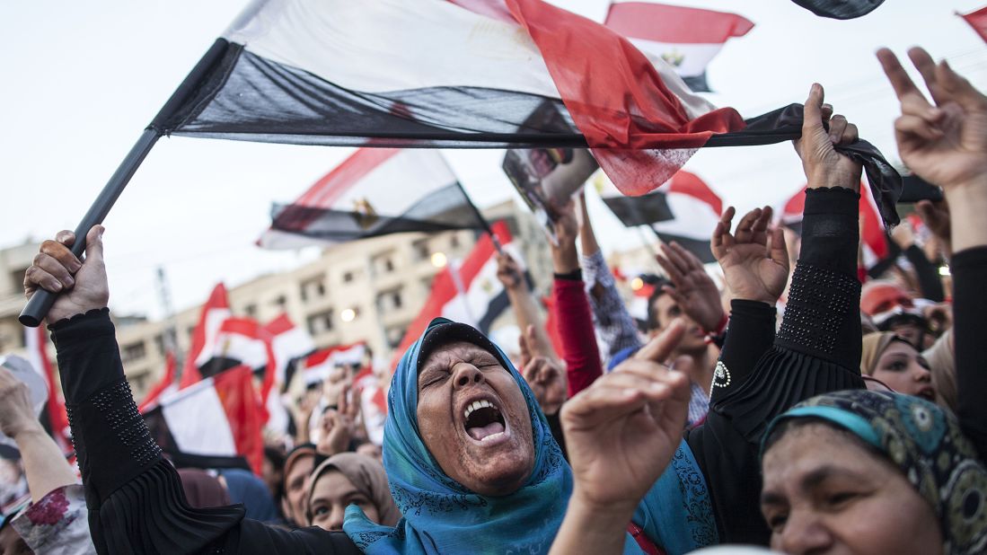Egyptians celebrate in front of the presidential palace in Cairo in June 2014 after former military chief Abdel Fattah el-Sisi wins a new presidential election.