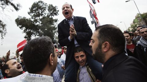 A man shouts political slogans during a march to the presidential palace in Cairo in December 2012.
