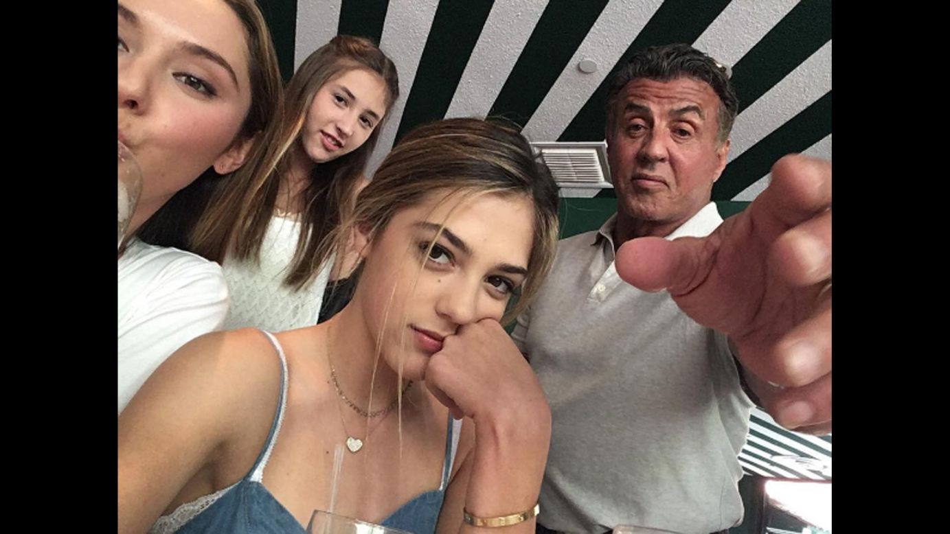 "Trying to get my phone back," <a href="https://www.instagram.com/p/BECvBfUxxRJ/" target="_blank" target="_blank">actor Sylvester Stallone said on Instagram</a> on Sunday, April 10. He is surrounded by his daughters Sophia, Scarlet and Sistine.