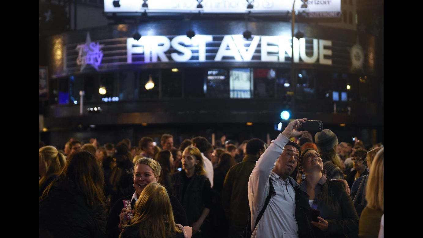 People take a selfie in front of First Avenue, the Minneapolis nightclub featured in the movie "Purple Rain," on Thursday, April 21. Prince, the iconic musician who starred in the film, <a href="http://www.cnn.com/2016/04/21/entertainment/gallery/prince-rogers-nelson/index.html" target="_blank">died earlier in the day.</a> He was 57.