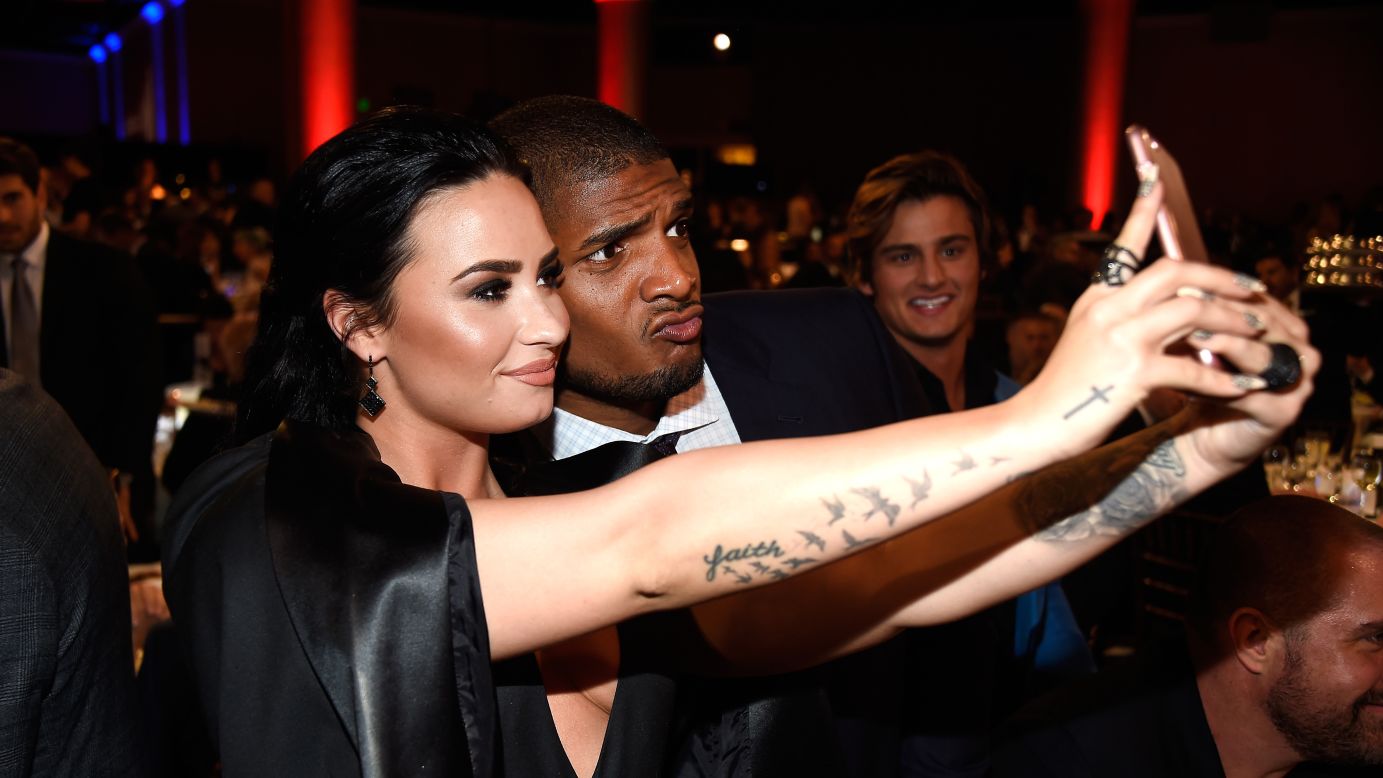Singer Demi Lovato and football player Michael Sam take a selfie at the GLAAD Media Awards on Saturday, April 2.