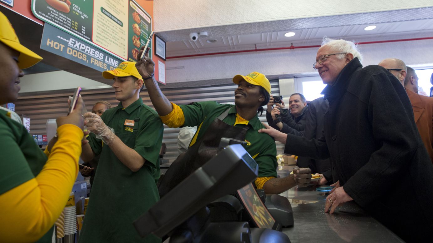 U.S. Sen. Bernie Sanders, who is seeking the Democratic Party's presidential nomination, poses for a selfie at a Nathan's hot dog restaurant on New York's Coney Island on Sunday, April 10.
