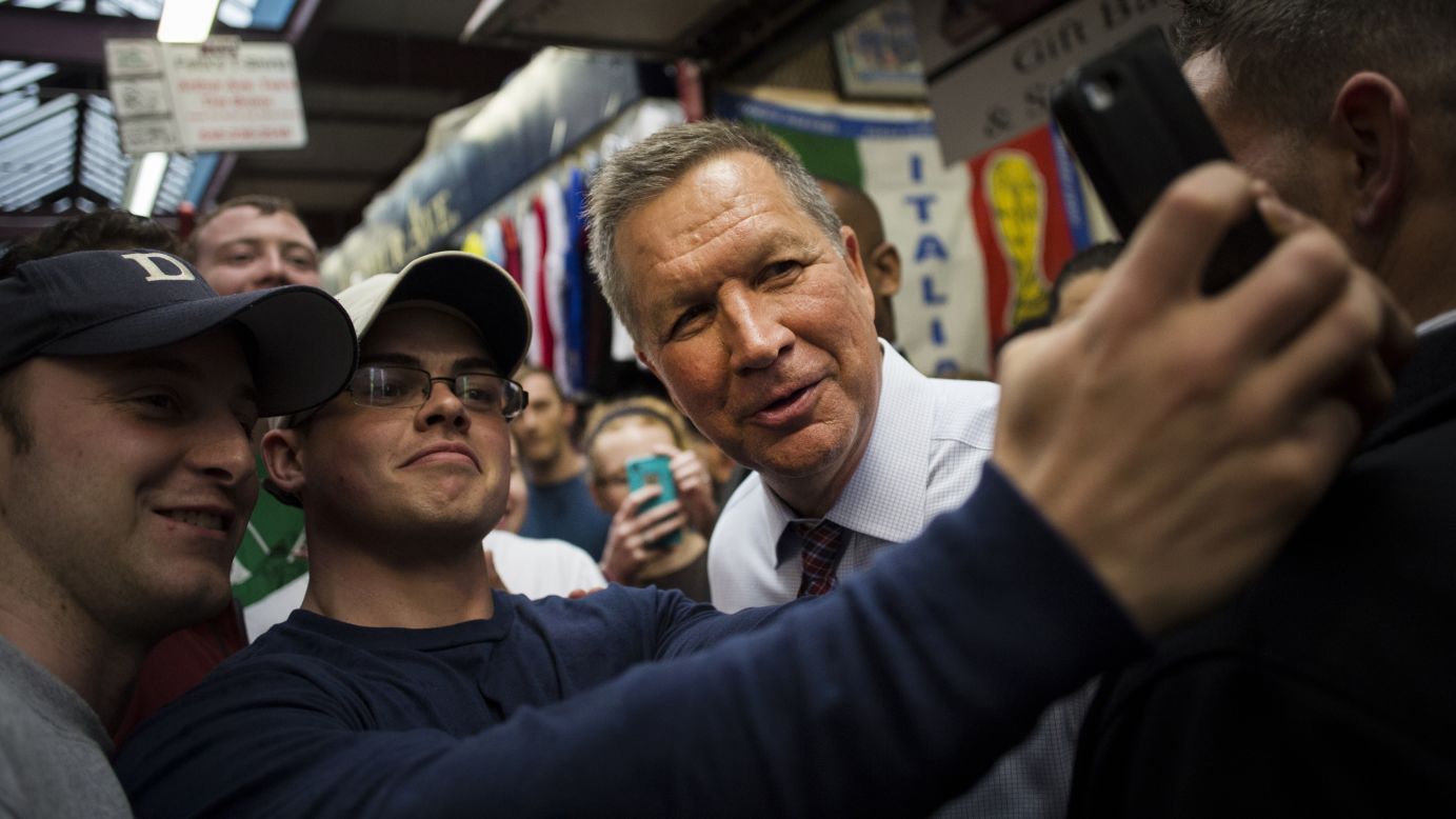 Ohio Gov. John Kasich, a Republican presidential candidate, poses for a selfie in New York on Thursday, April 7.