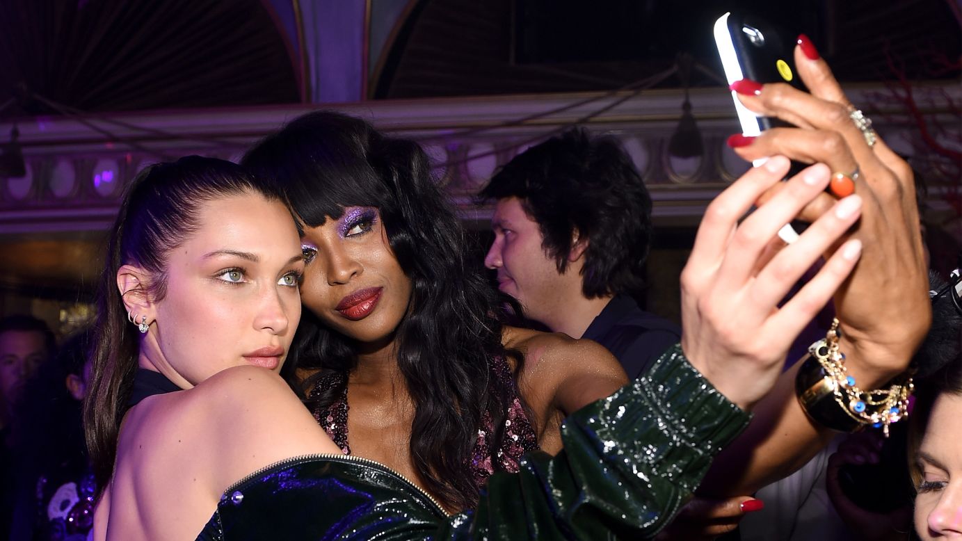 Models Bella Hadid, left, and Naomi Campbell take a photo together during a book launch party in New York on Thursday, April 7.