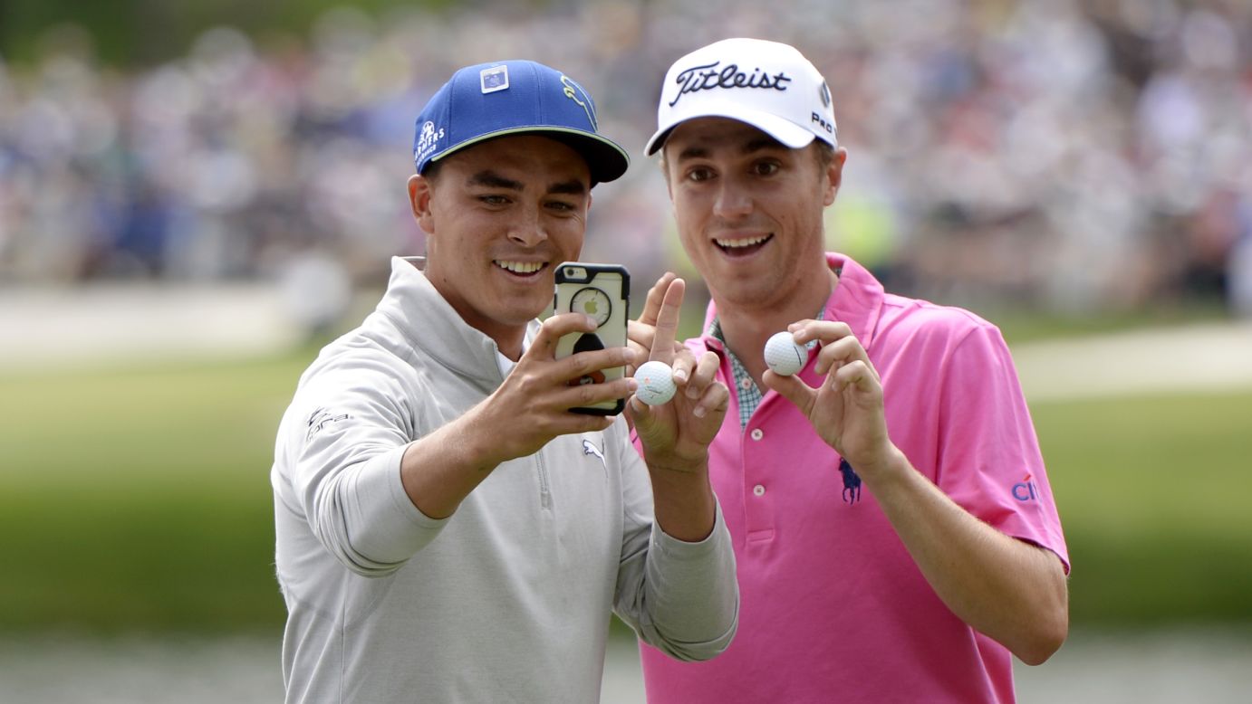 Pro golfers Rickie Fowler, left, and Justin Thomas take a photo together after they both made hole-in-ones at the Masters Par 3 Contest on Wednesday, April 6.