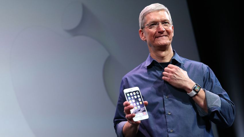 Apple CEO Tim Cook shows off the new iPhone 6 and the Apple Watch during an Apple special event at the Flint Center for the Performing Arts on September 9, 2014 in Cupertino, California. Apple is expected to unveil the new iPhone 6 and wearble tech.  (Photo by Justin Sullivan/Getty Images)