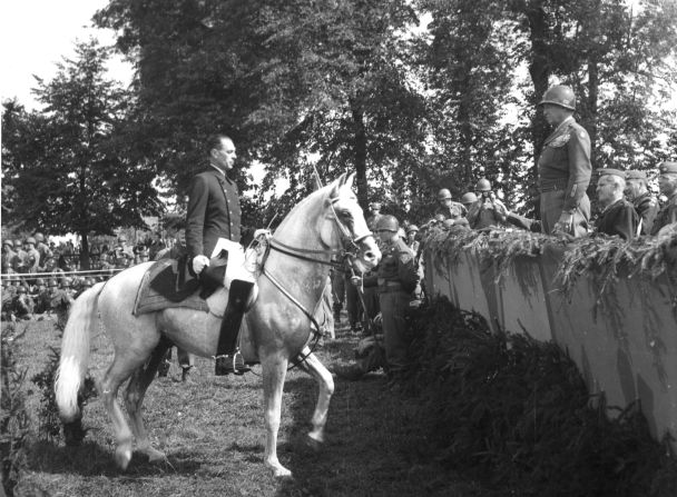 Austrian Colonel Alois Podhajsky, director of the Spanish Riding School from which many of the horses were captured and taken to Hostau, performs for General Patton.