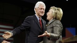 Democratic presidential candidate Hillary Clinton stands with former President Bill Clinton at her presidential primary election night rally on Tuesday, April 26 in Philadelphia.