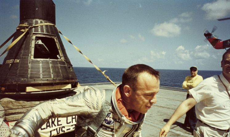 Shepard walks on the USS Lake Champlain after his landing. President Kennedy awarded him the Distinguished Service Medal one day later, and a ticker-tape parade drew 250,000 people in Washington. Decades later, Glenn recalled the significance of Shepard's accomplishment. "We had been beaten in the early days of the space race by a country that bragged (by saying) America now sleeps under a Soviet moon. But Al brought us back."