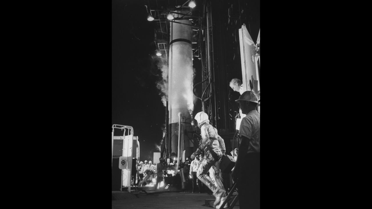 Shepard walks to the rocket that would launch his capsule into space. He was one of the Mercury Seven -- NASA's first astronauts.