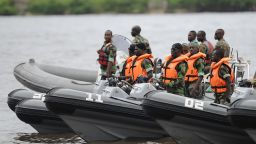 Soldiers of the Ivorian navy commandos stand on speedboats newly purchased by Ivorian navy from France at Abidjan military base, on June 23, 2014, before the arrival of the newly purchased RPB 33 patrol boat. This is the first of three patrol boats purchased by Ivorian navy from France as part of an Ivorian Defence program to develop its navy as it confronts a growing threat from pirates in the Gulf of Guinea. AFP PHOTO/ SIA KAMBOU        (Photo credit should read SIA KAMBOU/AFP/Getty Images)