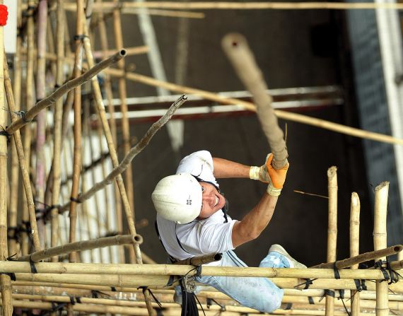 A technique known as "riding the bamboo" involves keeping an ankle wrapped around the pole at all times, allowing workers to keep their hands free while remaining secure.