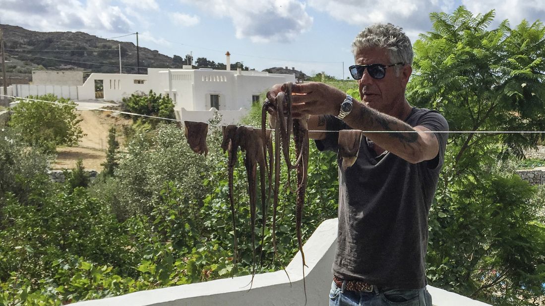 Anthony Bourdain strings up fresh octopus Naxian style to dry it out before cooking.