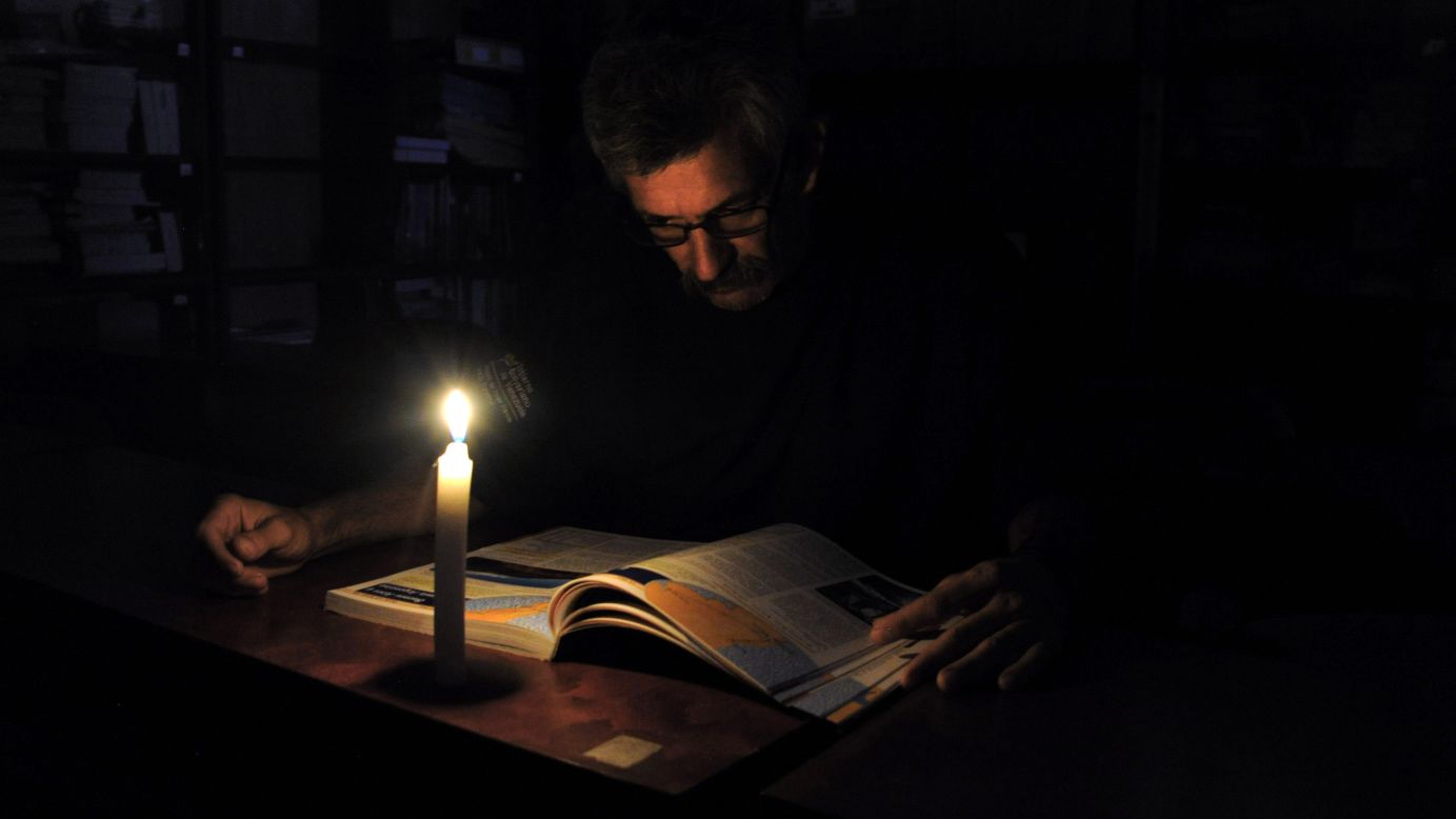 A man reads by candlelight after power was cut in the Venezuelan state of San Cristobal on Monday, April 25. The country, dealing with a severe power shortage, has begun <a href="http://www.cnn.com/2016/04/26/americas/venezuela-blackouts/" target="_blank">40 days of rolling blackouts.</a>