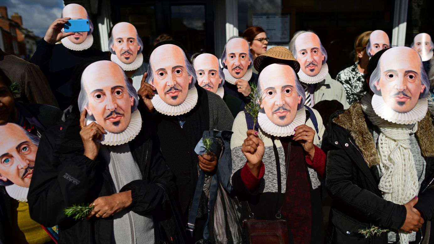 People wear William Shakespeare masks as they prepare for a parade in Stratford-upon-Avon, England, on Saturday, April 23. The famous poet died 400 years ago. 