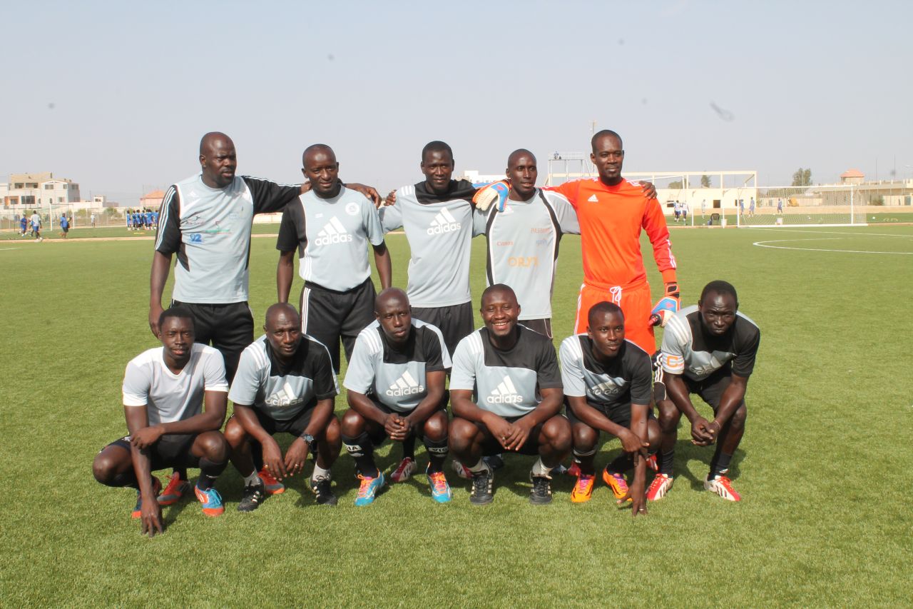 The boys having a coaching team of 11 (pictured,) plus two on-site physiotherapists. "Above all, we form men -- young Senegalese men -- so they can later become businessmen, ministers, presidents, and not exclusively football players," says head coach Moussa Kamara (second left, bottom row.) "That's the big difference between Diambars and others."
