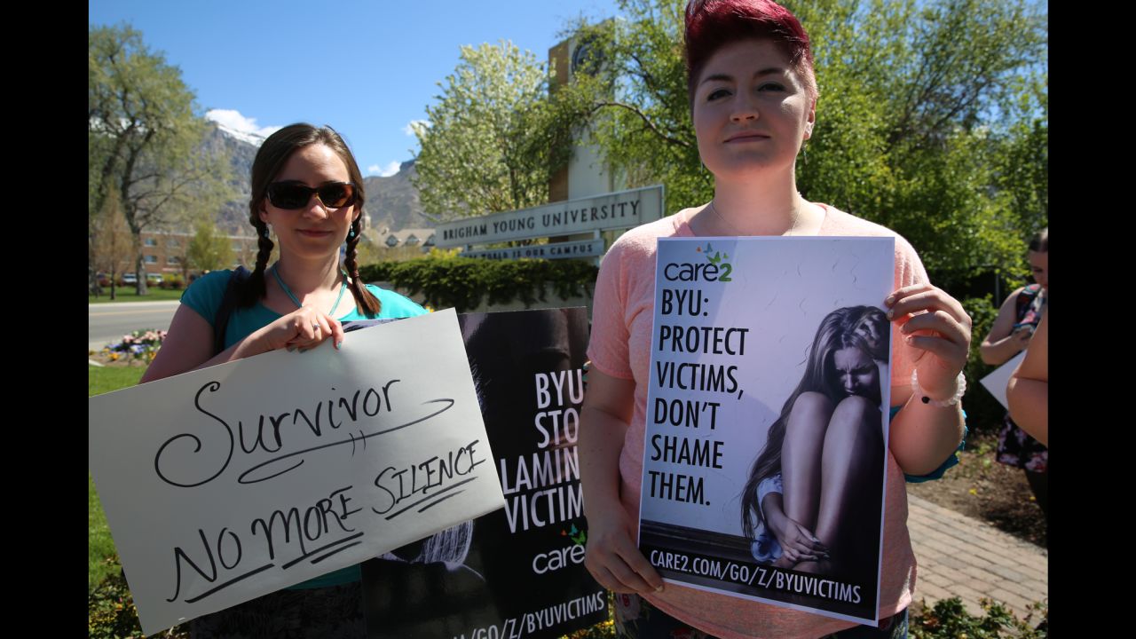 Sarah Belt, left, and Nyrie Hadnot are not students but attended a rally at Brigham Young University to support sexual assault survivors and fight for immunity for rape victims.
