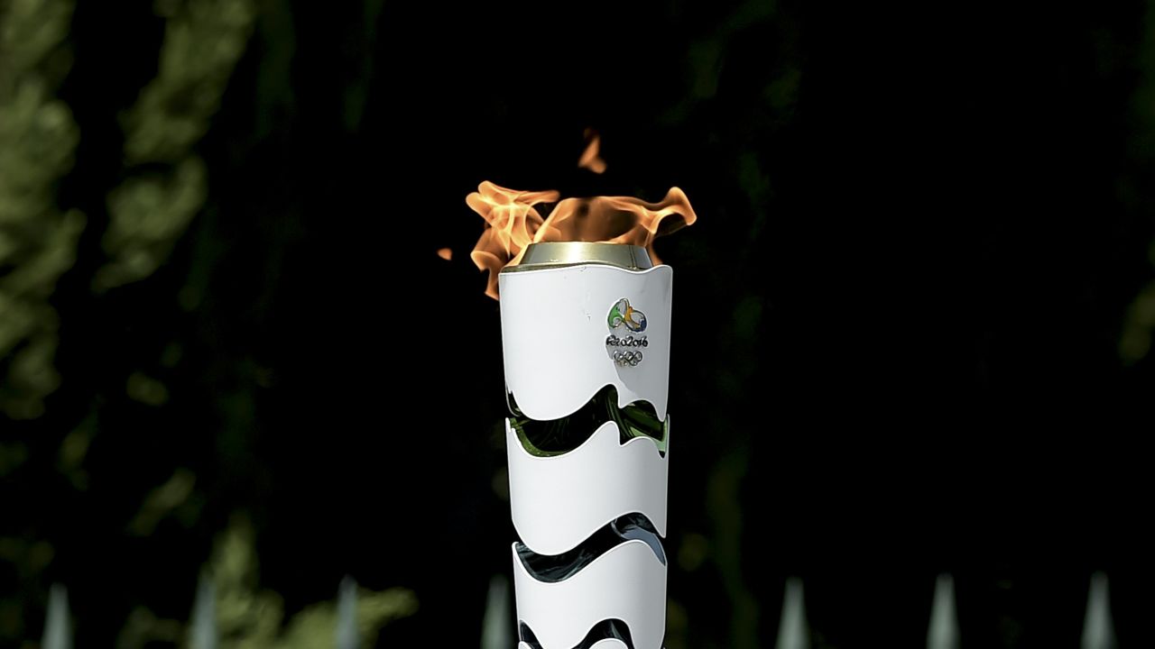 The Olympic Flame burns on a torch during the torch relay, on April 21, 2016, qfter the lighting ceremony of the Olympic flame in ancient Olympia, the sanctuary where the Olympic Games were born in 776 BC. 
The Olympic flame was lit Thursday in an ancient temple in one country in crisis and solemnly sent off carrying international hopes that Brazil's political paralysis will not taint the Rio Games that start in barely 100 days. / AFP / ARIS MESSINIS        (Photo credit should read ARIS MESSINIS/AFP/Getty Images)