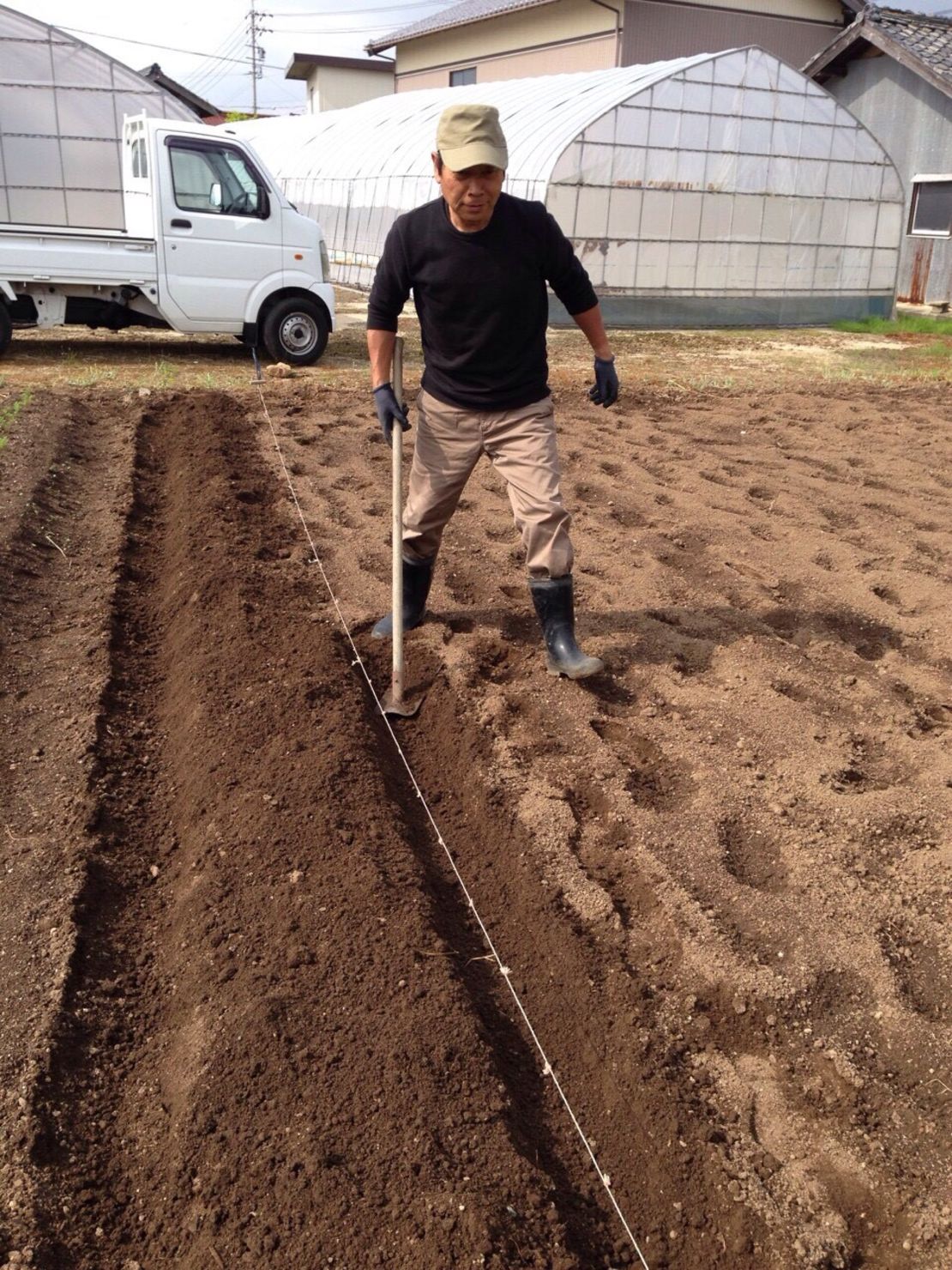 Yoshihide Ito, 63, growing vegetables