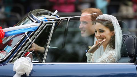 Prince William and Catherine, Duchess of Cambridge drive from Buckingham Palace in a decorated sports car on April 29, 2011 in London, England. 