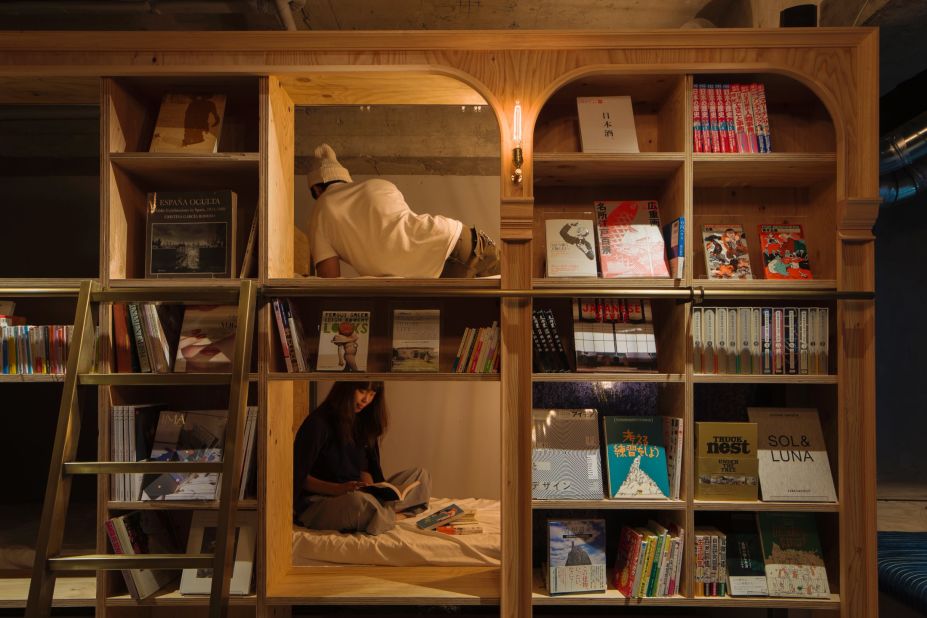 Opened in late 2015, the bulk of Book and Bed's beds sit inside a long wooden bookcase found in the main area of the hostel.