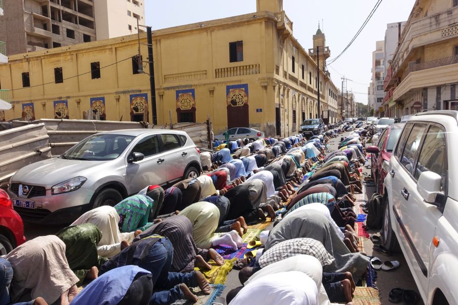 Senegal is 94% Muslim but is also home to 10 distinct ethnic groups. The overflow from the mosques spills into the streets during Friday prayers in Dakar.