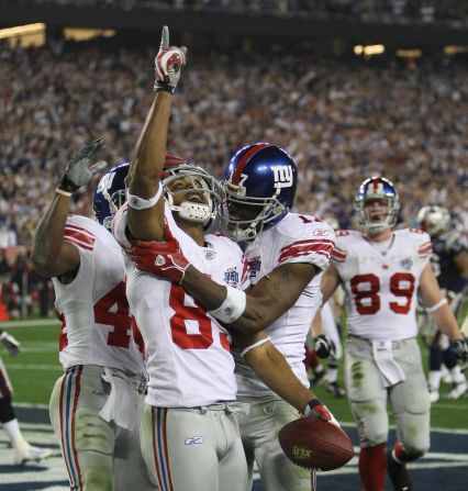 <strong>New England Patriots, Super Bowl XLII: </strong>New York Giants David Tyree (pointing) celebrates after scoring the second touchdown against the previously undefeated New England Patriots.  The Giants won 17-14 -- perhaps the most shocking upset in Super Bowl history. 