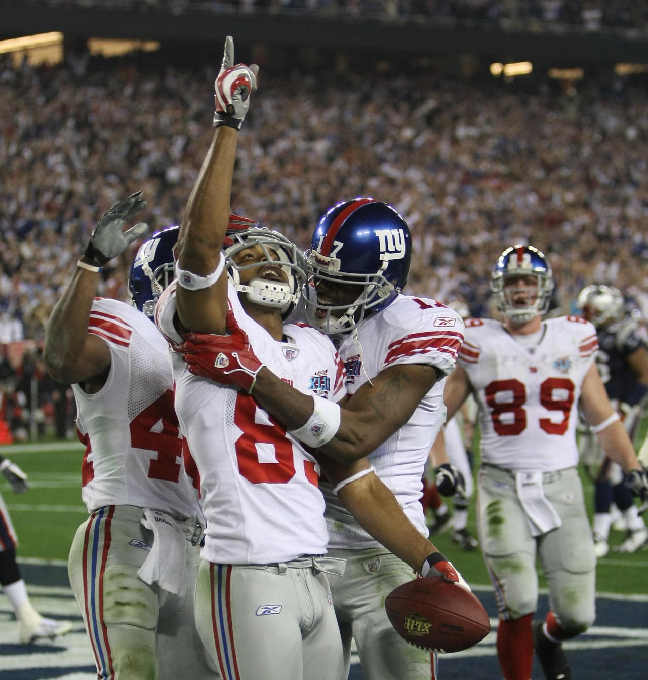 <strong>New England Patriots, Super Bowl XLII: </strong>New York Giants David Tyree (pointing) celebrates after scoring the second touchdown against the previously undefeated New England Patriots.  The Giants won 17-14 -- perhaps the most shocking upset in Super Bowl history. 