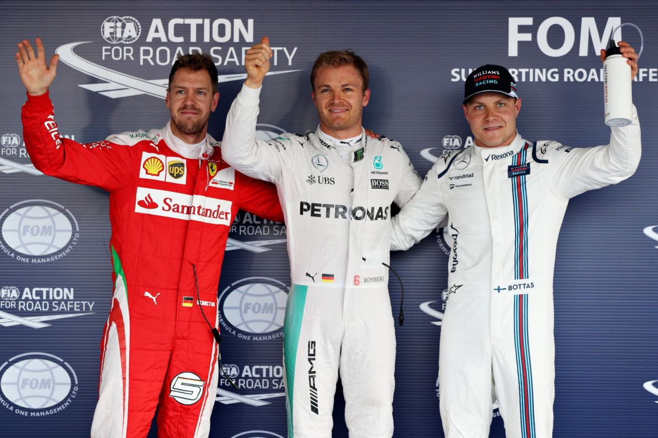 Top three qualifiers, Nico Rosberg of Germany and Mercedes GP, Sebastian Vettel of Germany and Ferrari and Valtteri Bottas of Finland and Williams celebrate in parc ferme during qualifying for the Formula One Grand Prix of Russia at Sochi Autodrom on April 30, 2016 in Sochi, Russia.