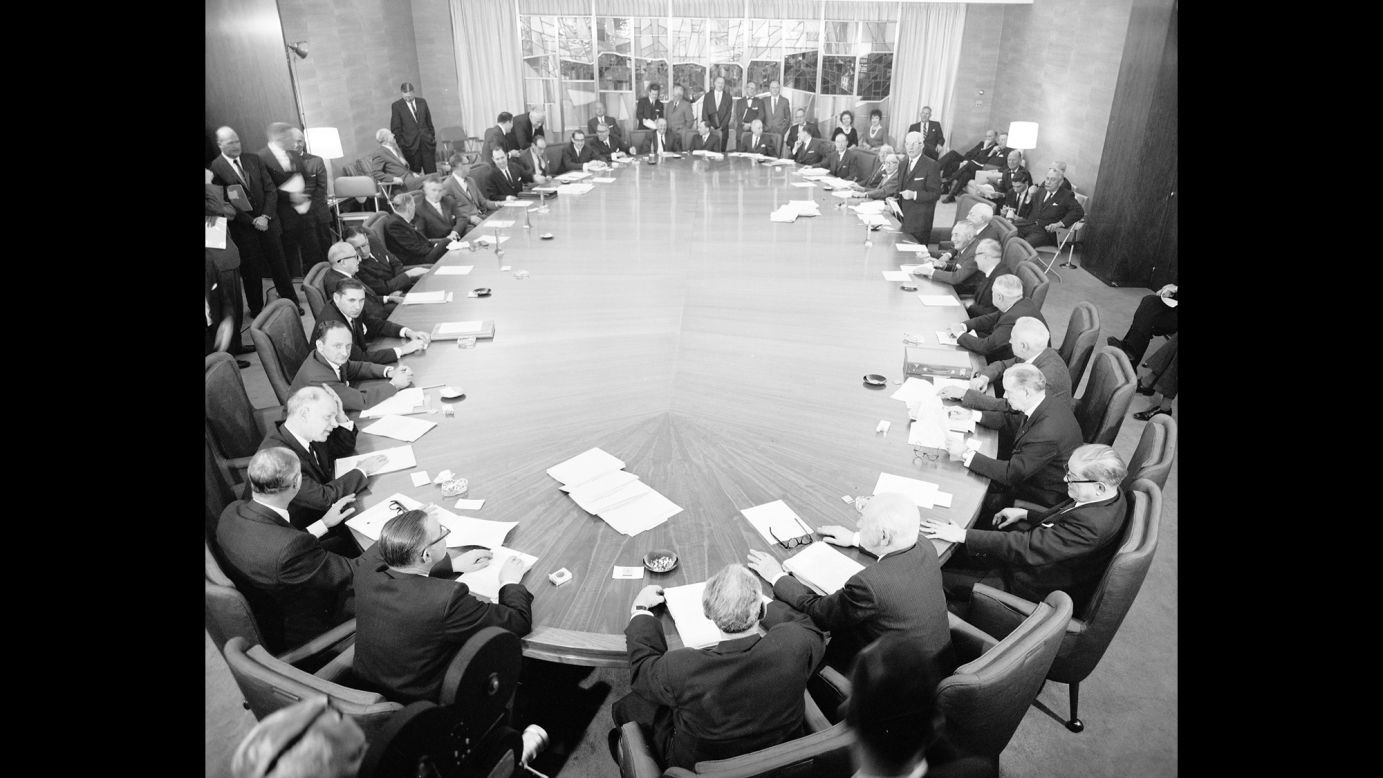 Negotiators sit at a table discussing the sale of the Empire State Building. The building is sold in 1951 for $34 million to a group led by Roger Stevens, but is also sold to Prudential Insurance Company of America, which agreed to a long-term lease.