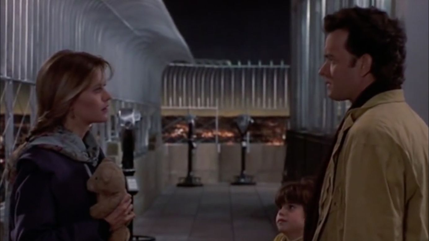 Actors Meg Ryan, Ross Malinger, center, and Tom Hanks are seen on the observation deck of in a scene from the 1993 film "Sleepless in Seattle." The building has been featured in several movies such as "An Affair to Remember," "Elf," and "The Amazing Spider-Man."