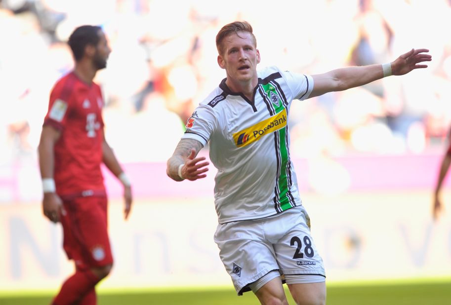 Andre Hahn of Borussia Moenchengladbach celebrates scoring his team's first goal during the Bundesliga match between Bayern Muenchen and Borussia Moenchengladbach at Allianz Arena.
