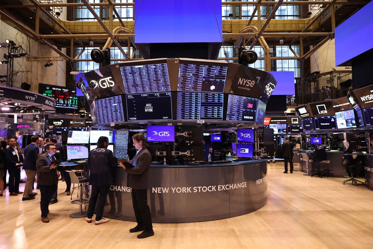 Traders work on the floor of the New York Stock Exchange during morning trading on July 31. 