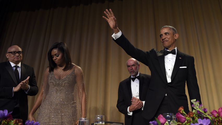 President Barack Obama, right, waves after speaking at the annual White House Correspondents' Association dinner at the Washington Hilton, in Washington, Saturday, April 30, 2016. Larry Wilmore, guest host from Comedy Central, left, first lady Michelle Obama, second from left, and Jerry Seib, second from fight, of The Wall Street Journal, join Obama on the stage. (AP Photo/Susan Walsh)