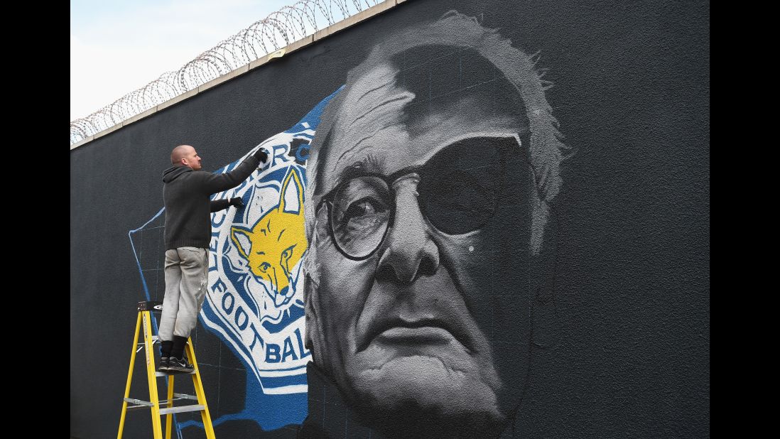 After the game Ranieri said he wouldn't be watching the game between Chelsea and Spurs. It was reported he would be on a plane flying from Italy to England after having taken out his 96-year-old mother for lunch. Here the Leicester manager is pictured in a painting on a wall.