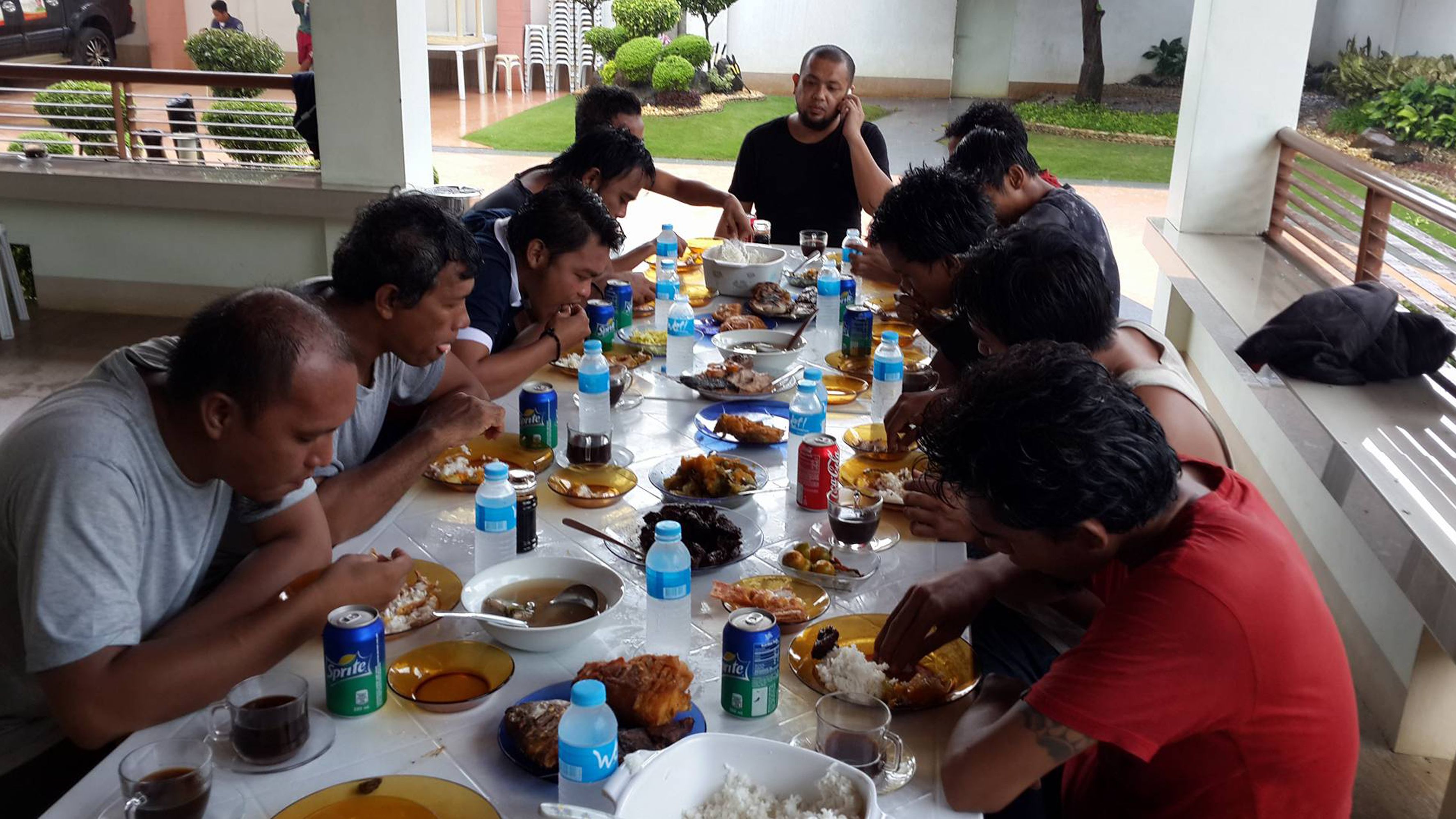Indonesian sailors eat a meal after being freed in Sulu province in the southern Philippines.