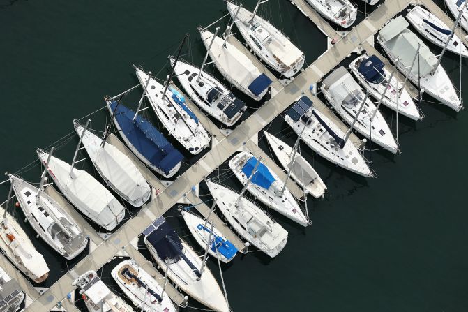 An impressive array of yachts lined up alongside a jetty at the Royal Prince Alfred yacht club. The Pittwater-based club has a history stretching back to the 1850s.