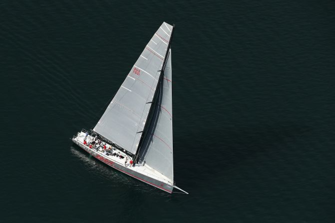 Maxi yacht Wild Oats X cuts through the calm surface of Pittwater. The yacht is a sister of Wild Oats XI, which set a Sydney-Hobart record of one day, 18 hours, 23 minutes and 12 seconds, in 2005 that remained unbeaten until 2012. In 2015, Comanche became the first American entry to win line honors since 1998 <a href="index.php?page=&url=http%3A%2F%2Fedition.cnn.com%2F2015%2F12%2F28%2Fsport%2Fsydney-hobart-yacht-race-comanche-sailing%2F" target="_blank">despite suffering damage en route</a>.