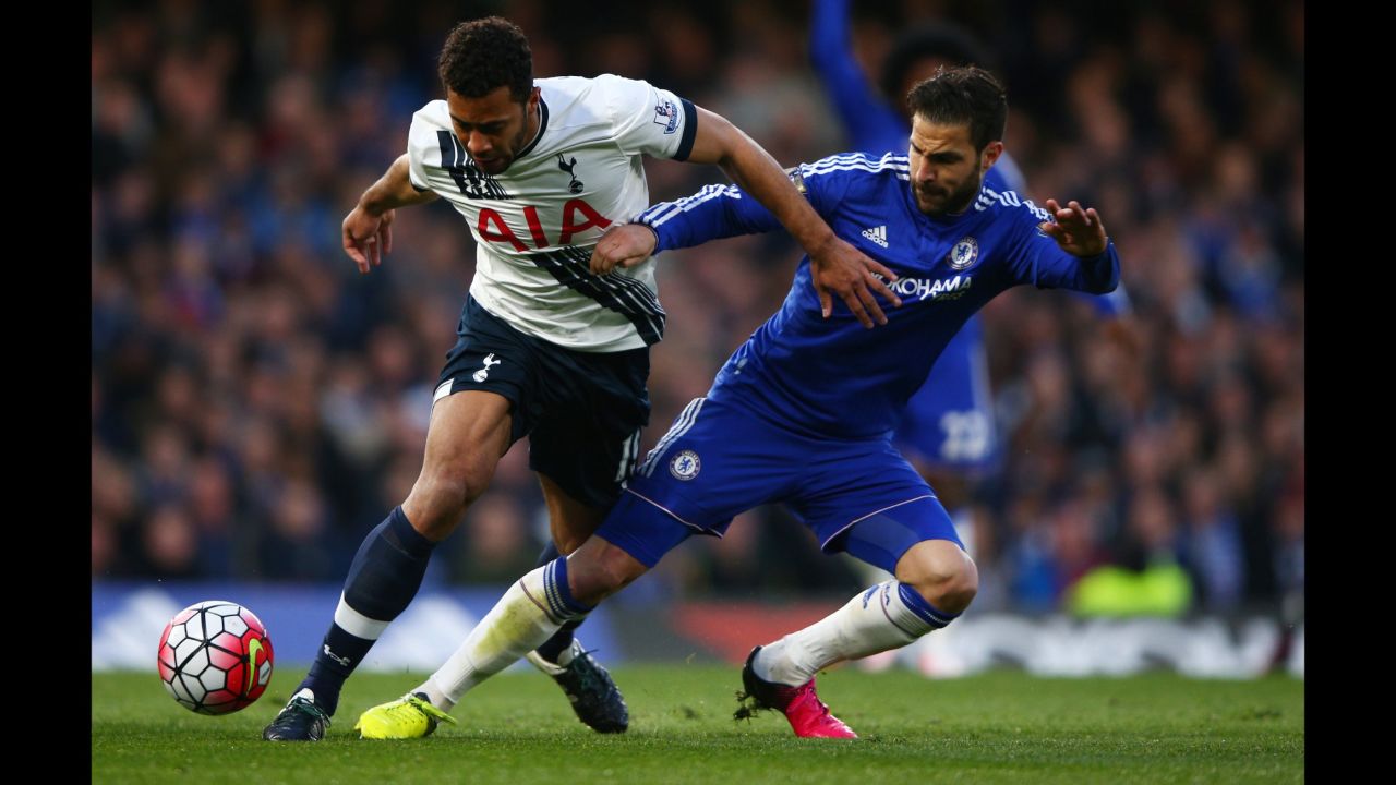 Tottenham's Mousa Dembele, left, is tackled by Chelsea's Cesc Fabregas during the match in London.