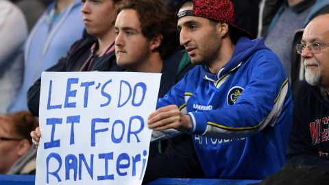 A Chelsea fan holds up a sign in support of Leicester City's title challenge. Leicester City manager Claudio Ranieri was once in charge of Chelsea.