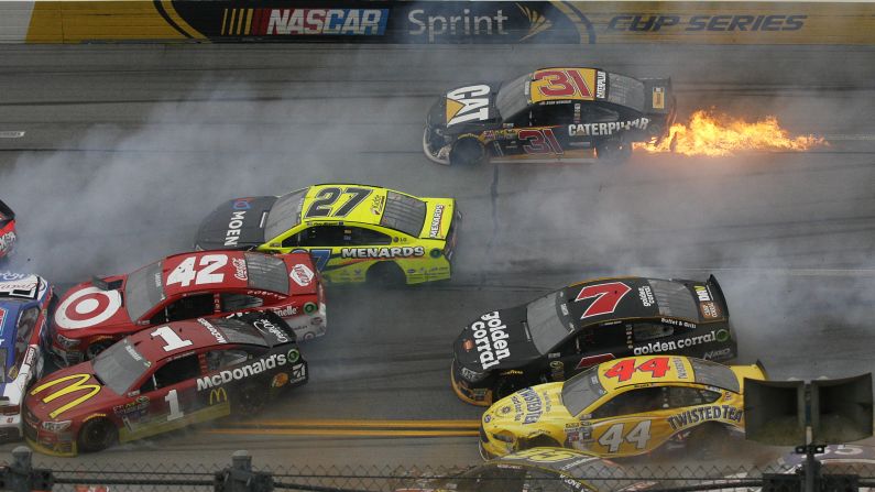 Flames trail from the car of Sprint Cup driver Ryan Newman during a pileup crash in Talladega, Alabama, on Sunday, May 1. More than a dozen cars were involved in the wreck. Nobody was seriously hurt.