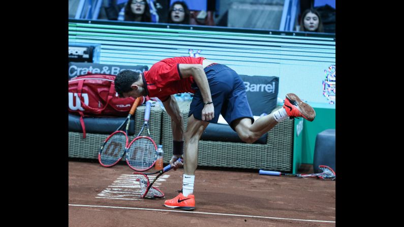 Grigor Dimitrov breaks his racket in frustration during the Istanbul Open final on Sunday, May 1. Dimitrov smashed three rackets during the match -- the last one cost him a game penalty and conceded the match to Diego Schwartzman.
