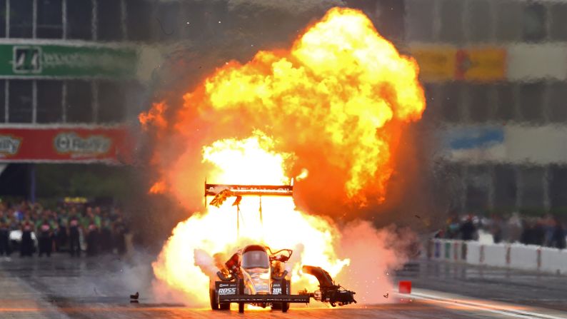 Fire billows from the car of Terry McMillen during a drag race in Baytown, Texas, on Sunday, May 1. It is not uncommon to see fire from dragsters as their engines are pushed to the limit.