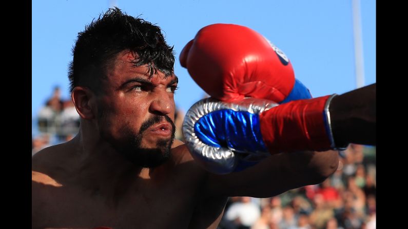 Victor Ortiz avoids a punch by Andre Berto during their welterweight bout in Carson, California, on Saturday, April 30. Berto stopped Ortiz in the fourth round.